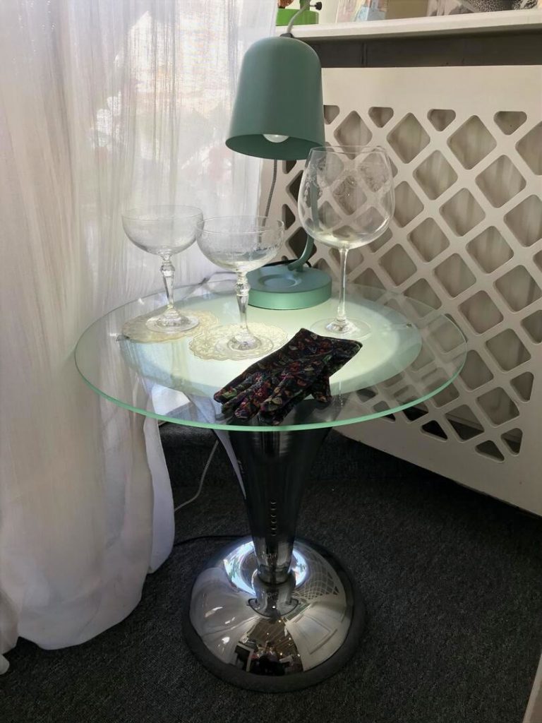 Chrome and glass 'trumpet' cocktail table £395