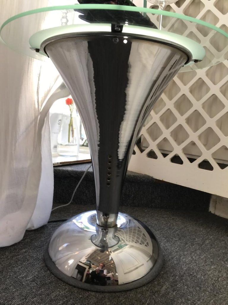 Showing the 'trumpet valve' holes -one set of the three positioned around the base to let light through